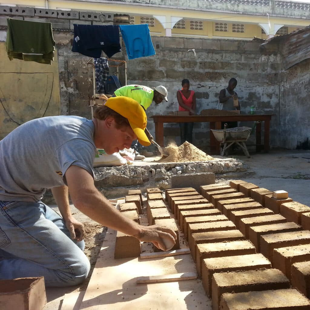 RAB_GALLERY Cody lays brick to dry in the sun